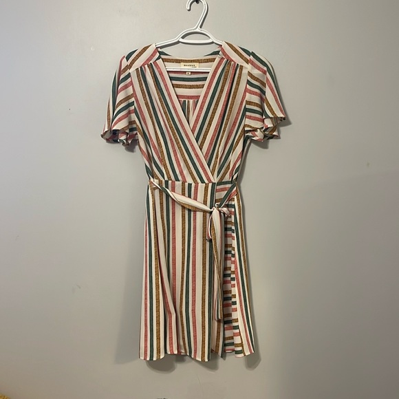 A multicoloured dress cute and fun dress. Stretches in back. Cinches at waste. - Picture 1 of 4